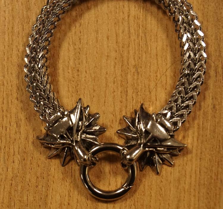 Armband " Koppen van draken " nikkelkleurig